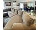 Inviting living room featuring a large sectional sofa and view into dining area at 304 Sandalwood Ave, Louisburg, NC 27549