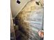Tiled walk-in shower features modern fixtures and storage niche, with pebble floor at 304 Sandalwood Ave, Louisburg, NC 27549