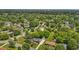 This aerial image shows the property's location within a lush, tree-filled residential neighborhood at 305 Oakgrove Dr, Graham, NC 27253