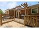 Back deck with seating, grill, and partial sun coverage at 305 Oakgrove Dr, Graham, NC 27253
