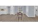 Bright dining room features light walls, wood floors, and lots of natural light from a large window at 305 W Canary St, Dunn, NC 28334