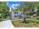 Exterior view of a modern two-story home featuring board and batten siding and a well-maintained yard at 305 W Canary St, Dunn, NC 28334