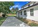 Charming two-story house featuring a concrete patio and manicured backyard at 305 W Canary St, Dunn, NC 28334