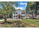 Beautiful two-story home showcasing board and batten siding, stone accents, and a well-manicured lawn at 305 W Canary St, Dunn, NC 28334