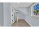 Bright hallway with a view to the exterior at 305 W Canary St, Dunn, NC 28334