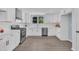 Modern kitchen features stainless appliances, white cabinetry, and lots of light at 305 W Canary St, Dunn, NC 28334