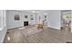 Inviting living room featuring wood floors, a fireplace, and lots of natural light at 305 W Canary St, Dunn, NC 28334