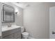 Clean bathroom featuring new fixtures, a mirror, and tiled walls at 3088 Colony Rd # A, Durham, NC 27705