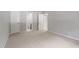 Inviting bedroom featuring plush carpet, neutral walls, and ample closet space at 3088 Colony Rd # A, Durham, NC 27705