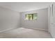 Cozy bedroom with neutral carpet, bright window, and closet to maximize space at 3088 Colony Rd # A, Durham, NC 27705