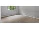 Bright bedroom featuring neutral carpet, a window and electrical outlets, perfect for customization at 3088 Colony Rd # A, Durham, NC 27705
