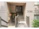 Condominium exterior featuring stairs, two units, and landscaping at 3088 Colony Rd # A, Durham, NC 27705