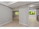 Spacious living room featuring sleek flooring and neutral walls, bathed in natural light at 3088 Colony Rd # A, Durham, NC 27705