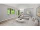 Inviting living room with modern furniture, natural light, and access to the dining area at 3088 Colony Rd # A, Durham, NC 27705