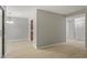 Bright and airy living room with modern light fixture, neutral walls and wood-look flooring at 3088 Colony Rd # A, Durham, NC 27705