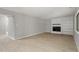 Spacious living room with a fireplace, built-in shelves, and hardwood floors at 3088 Colony Rd # A, Durham, NC 27705