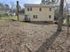 View of the backyard of the home that can be landscaped to the new owner's desire at 309 Wyatts Pond Lane, Cary, NC 27513