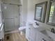 This bathroom features a tiled shower with sliding glass doors and a double vanity at 309 Wyatts Pond Lane, Cary, NC 27513