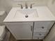 This bathroom vanity features white cabinets, a modern sink and brushed-nickel hardware at 309 Wyatts Pond Lane, Cary, NC 27513
