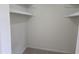 A bright empty closet with shelving and neutral carpet at 309 Wyatts Pond Lane, Cary, NC 27513