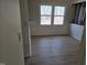 Bright dining room featuring large window and stylish, new flooring at 309 Wyatts Pond Lane, Cary, NC 27513
