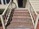 Close up view of the brick steps leading to the front door with white railings at 309 Wyatts Pond Lane, Cary, NC 27513