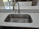 Close up of the kitchen sink and countertop showcasing updated fixture at 309 Wyatts Pond Lane, Cary, NC 27513