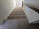 Carpeted staircase leading to the upper level of the home at 309 Wyatts Pond Lane, Cary, NC 27513