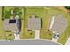 Birds eye view of a home with solar panels, well-manicured lawn, outdoor play equipment, and ample parking space at 31 Pascoli Ct, Clayton, NC 27527