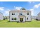 The backyard features a covered patio and a large, well-maintained lawn at 31 Pascoli Ct, Clayton, NC 27527