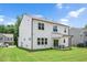 Backyard with well maintained lawn, covered patio, and white siding at 31 Pascoli Ct, Clayton, NC 27527