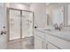 Bathroom featuring a glass enclosed shower and modern vanity with a white countertop at 31 Pascoli Ct, Clayton, NC 27527