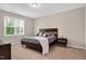 This bedroom has carpet, one window and a wood bed frame with a gray bed spread at 31 Pascoli Ct, Clayton, NC 27527