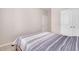 This bedroom has carpet, and a bed frame with a striped bed spread at 31 Pascoli Ct, Clayton, NC 27527