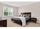 This bedroom has carpet, one window and a wood bed frame with a gray bed spread at 31 Pascoli Ct, Clayton, NC 27527