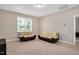 Comfortable bonus room featuring neutral colored sofas and a bright window at 31 Pascoli Ct, Clayton, NC 27527