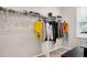 This closet has clothes hanging on the rack and shoes stacked on the shelf at 31 Pascoli Ct, Clayton, NC 27527