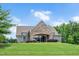 Charming community clubhouse featuring stone accents, covered entry, and well-maintained landscaping at 31 Pascoli Ct, Clayton, NC 27527