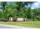 Inviting San Marino community entrance sign surrounded by mature trees and manicured landscaping at 31 Pascoli Ct, Clayton, NC 27527