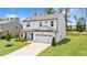 Aerial view of a home with a well-manicured lawn and a bright blue front door at 31 Pascoli Ct, Clayton, NC 27527