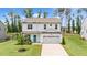 Aerial view of a home with a well-manicured lawn and a bright blue front door at 31 Pascoli Ct, Clayton, NC 27527