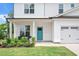 Inviting front porch with seating area, vibrant blue door, and well-maintained landscaping at 31 Pascoli Ct, Clayton, NC 27527
