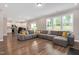 Spacious living room with large sectional sofa and plenty of natural light at 31 Pascoli Ct, Clayton, NC 27527