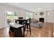 Open living area with hardwood floors, fireplace, and sliding glass doors to the patio at 31 Pascoli Ct, Clayton, NC 27527