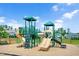 Fun playground featuring multiple slides, climbing walls, and safe play surface within fenced area at 31 Pascoli Ct, Clayton, NC 27527