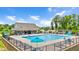 Inviting community swimming pool with lounge chairs, umbrellas, and a clubhouse for residents' enjoyment at 31 Pascoli Ct, Clayton, NC 27527