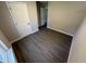 Cozy bedroom showcasing wood-look flooring, fresh paint, and modern white trim at 311 W Market St, Graham, NC 27253