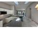 Bright, open-concept kitchen with white cabinets, granite countertops and stainless steel appliances at 311 W Market St, Graham, NC 27253