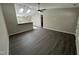Contemporary living room showcasing a seamless layout, wood flooring, and skylights at 311 W Market St, Graham, NC 27253