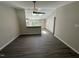 Open-concept living room featuring wood-look floors and plenty of natural light at 311 W Market St, Graham, NC 27253